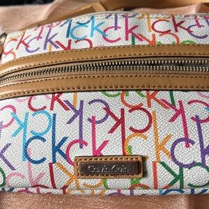 Calvin Klein small crossbody purse. CK logo in various colors.